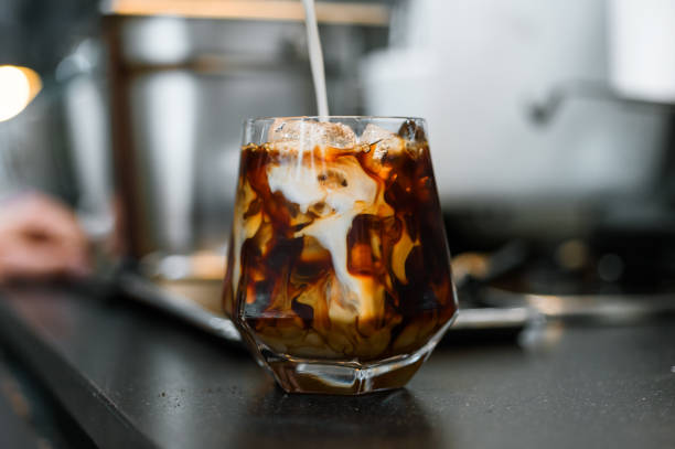 istock Glass of coffee on the table 1350756758