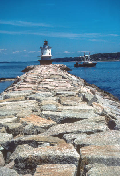 istock Portland Maine - Spring Point Ledge Light & Lobster Boat 1985 1350757832