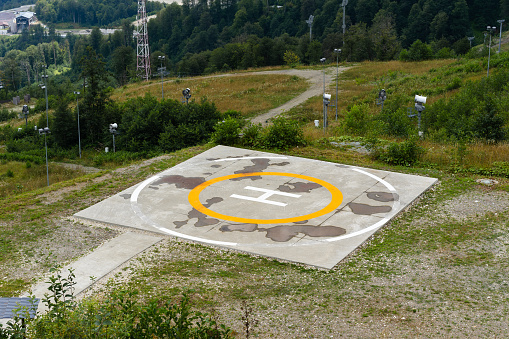 Concrete helicopter parking and mountain view in Russia, Sochi