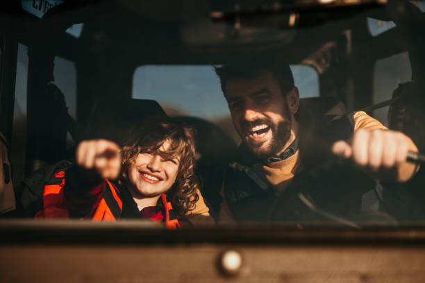 istock Father and son in truck ready for camping 1350758856