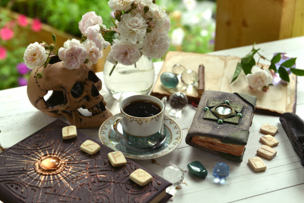 istock Vintage summer still life with runes, old book, crystals and witch magic objects. 1350758915