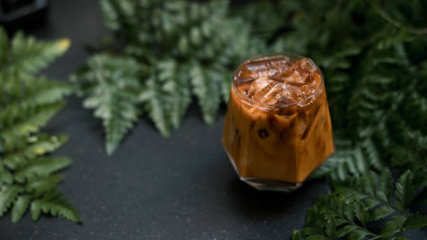 istock Glass of coffee on the table 1350761814