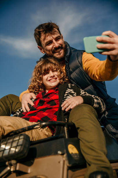 istock Dad and son having a road trip adventures 1350764233