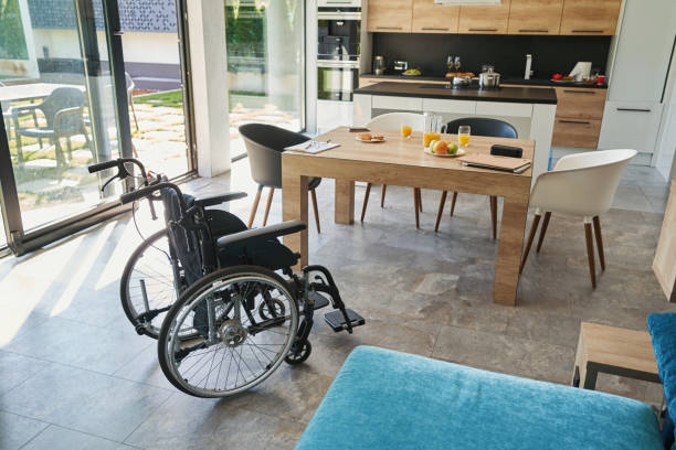istock Empty manual wheelchair standing in the kitchen 1350766022