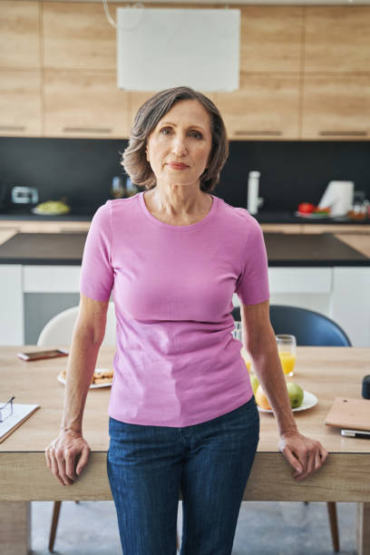 istock Elderly person resting against table in the kitchen 1350766024