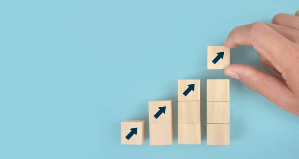 istock Wooden blocks chart steps with copy space. The business growth process 1350766790