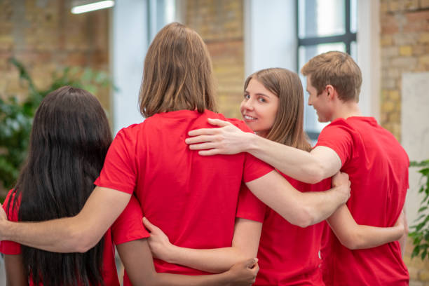 istock Team of young volunteers in red tshirt 1350772173