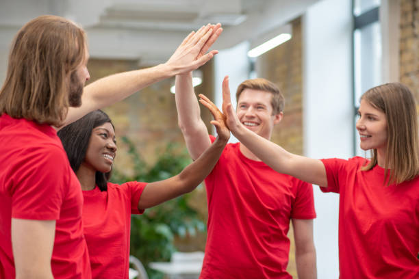 istock A group of young people having teambuilding activities and looking enjoyed 1350772192