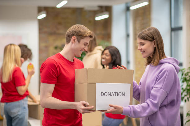 istock Volunteers working in a donations distribution center 1350772261