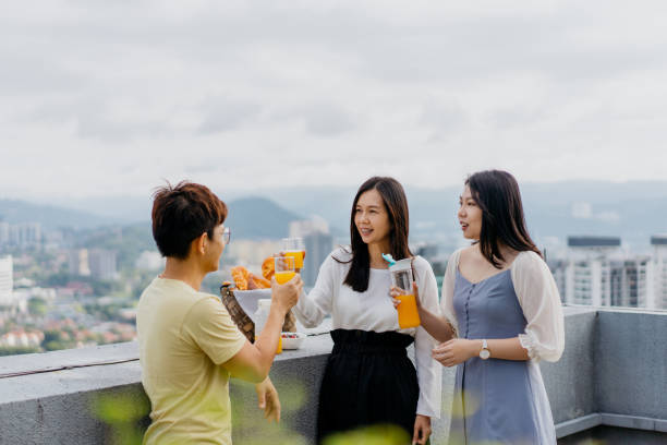 istock Friends having rooftop party in city 1350772468