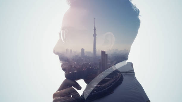 istock Silhouette of thinking man and modern cityscape. Double exposure. 1350773274