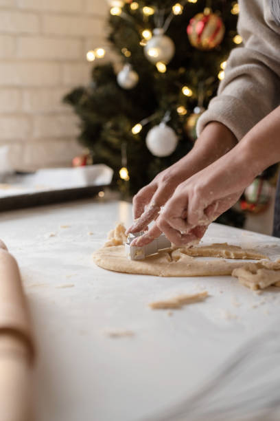 istock Smiling woman in the kitchen baking christmas cookies 1350773281