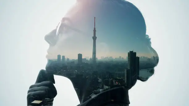 Silhouette of thinking woman and modern cityscape. Double exposure.