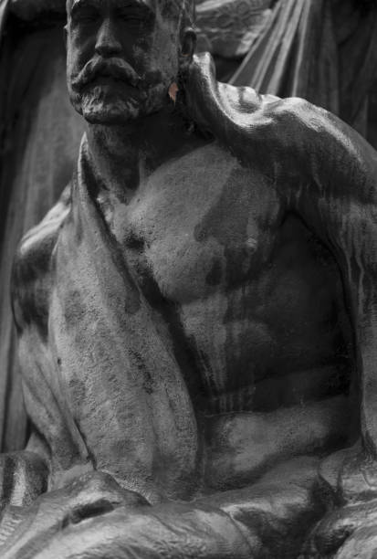 istock Closeup pf male statue in Retiro Park, Madrid, Spain 1350777921