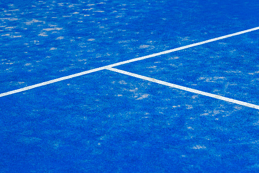 Blue paddle tennis court. Blue court with white lines. Horizontal sport poster, greeting cards, headers, website\