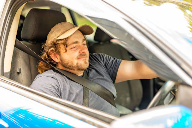 istock Disabled man with no legs driving his car 1350785448