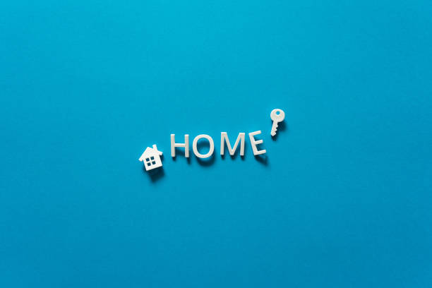 istock Inscription home from letters on a blue background 1350785510