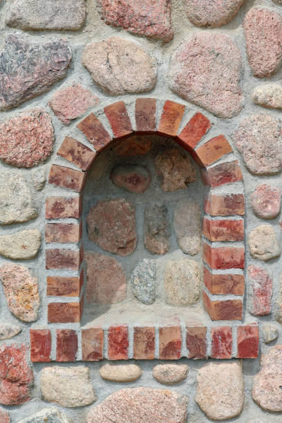istock Flower niche in a stone church  wall 1350786617