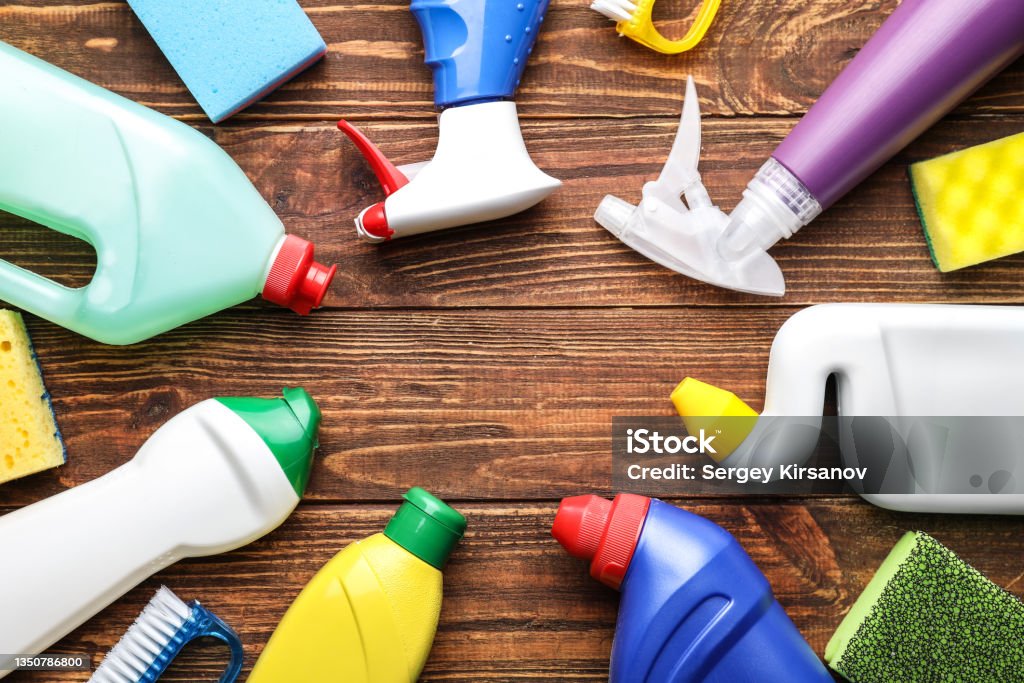 Frame made of cleaning supplies on wooden background Cleaning Product Stock Photo