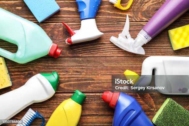 Frame Made Of Cleaning Supplies On Wooden Background Stock Photo - Download Image Now