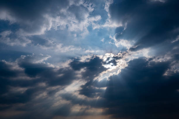 istock God light. Dark cloudy sky with sun beam. Sun rays through black clouds. God light from heaven for hope and faithful concept. Believe in god. Heaven sky. Overcast sky. Spiritual religious background. 1350786841
