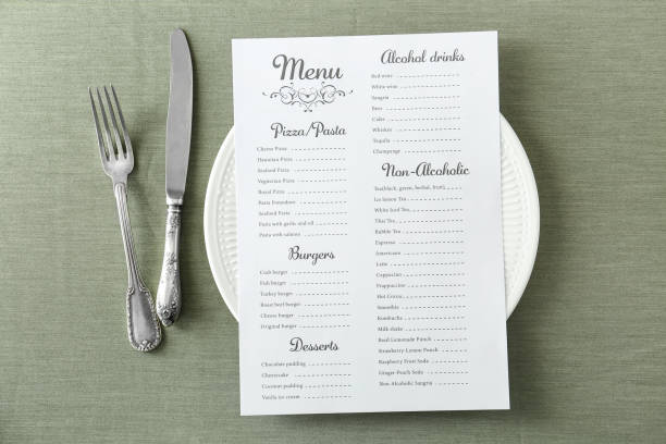 Menu on served table in restaurant stock photo
