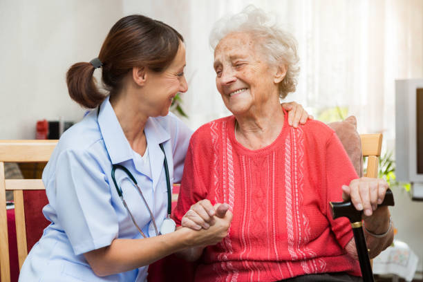 istock Care – Nurse with Senior Patient 1350788100
