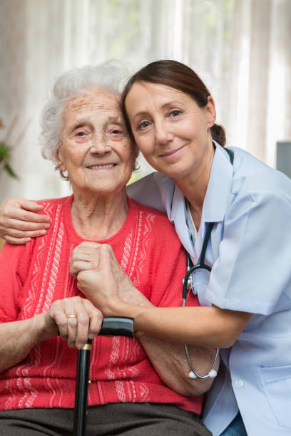 istock Care – Nurse with Senior Patient 1350788126