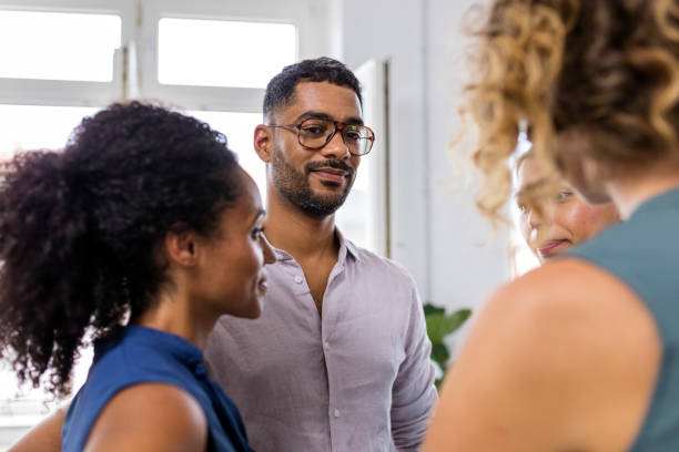 istock Multi-Ethnic Business Colleagues Discussing Ideas 1350788489