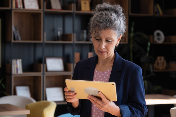 istock senior women making online calls with digital tablet 1350790487