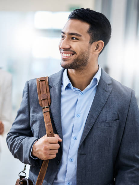 istock Shot of a business smiling while walking through the office 1350790876