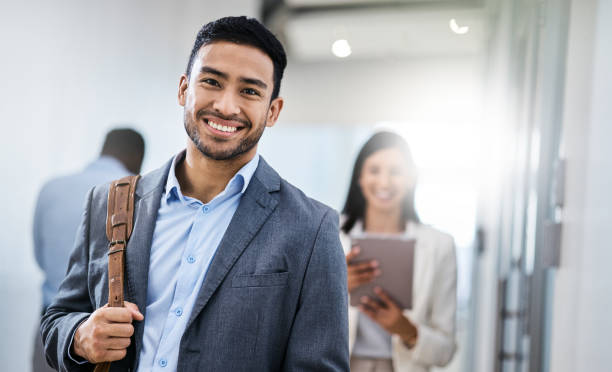 istock Shot of a business smiling while walking through the office 1350790887