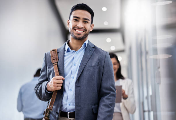 istock Shot of a business smiling while walking through the office 1350790898