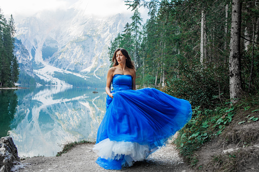 A beautiful brunette princess at a picturesque lake setting in Northern Italy