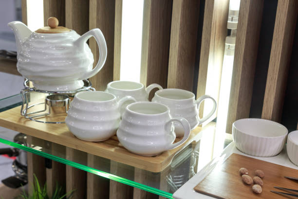 istock New cookware, white porcelain teapot and traditional tea cups. Kitchen interior 1350791862