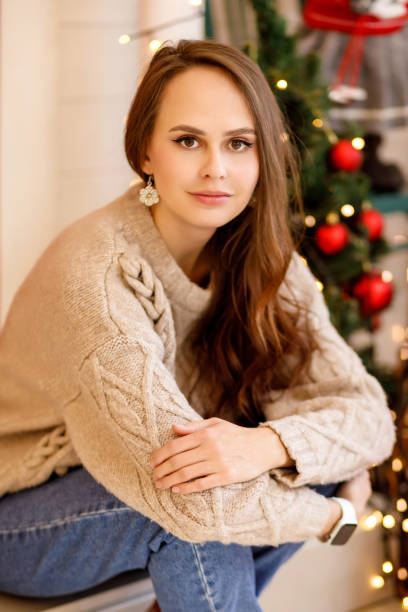 istock young woman in christmas decorations 1350792110