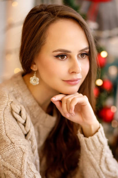 istock young woman in christmas decorations 1350792237
