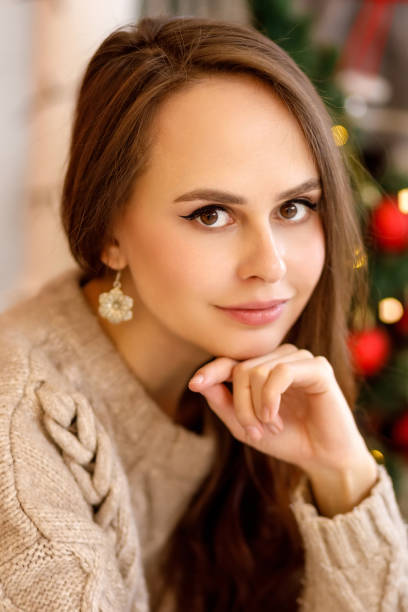 istock young woman in christmas decorations 1350792240