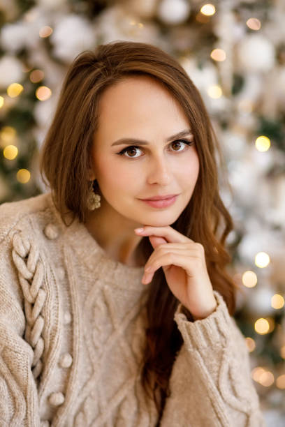 istock young woman in christmas decorations 1350792343