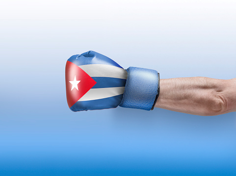Man hand fist of CUBA flag painted. Close-up