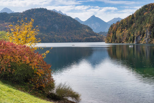 istock Lake with Autumn trees and background mountains 1350793474