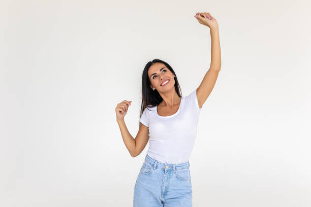 istock Successful woman looking very happy isolated over a white backgorund 1350793565