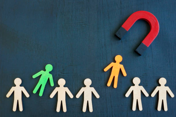 istock The magnet attracts figures from the crowd. Talent acquisition concept. 1350793901