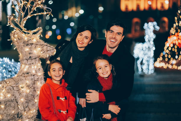 istock Family outside at Christmas night 1350794062