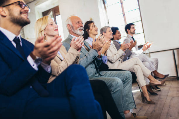 istock Happy business team applauding after successful group meeting 1350795109