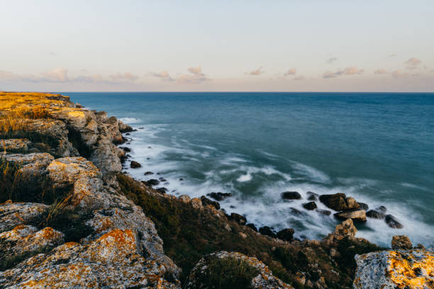istock Landscape Long exposure beach with Crashing Waves and Rocks 1350796400