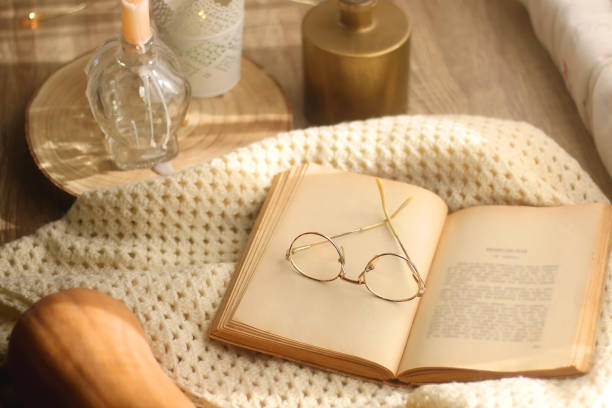 istock Pumpkin, Book, Blanket and Candles 1350798639