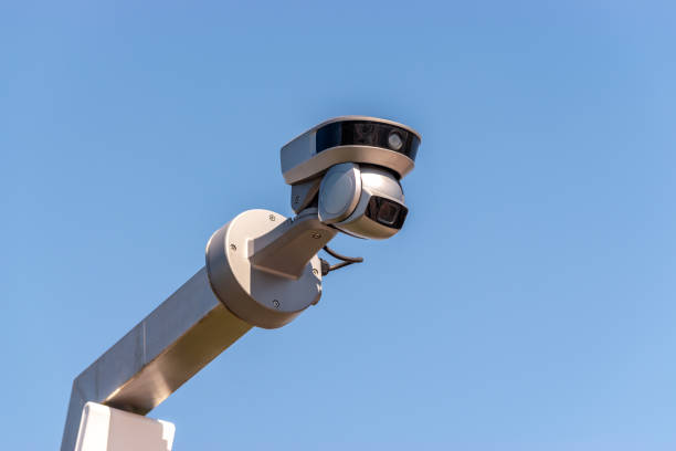 istock Street surveillance camera on sky background. 1350799347