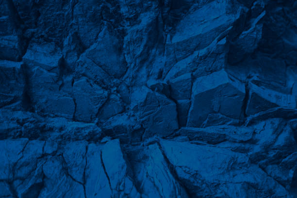 istock Blue rock texture. Toned mountain surface. Close-up. Navy blue  grunge background for design. 1350800096