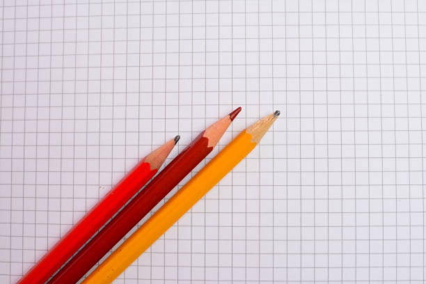 istock Blank notebook and pencils on white wooden background 1350800546